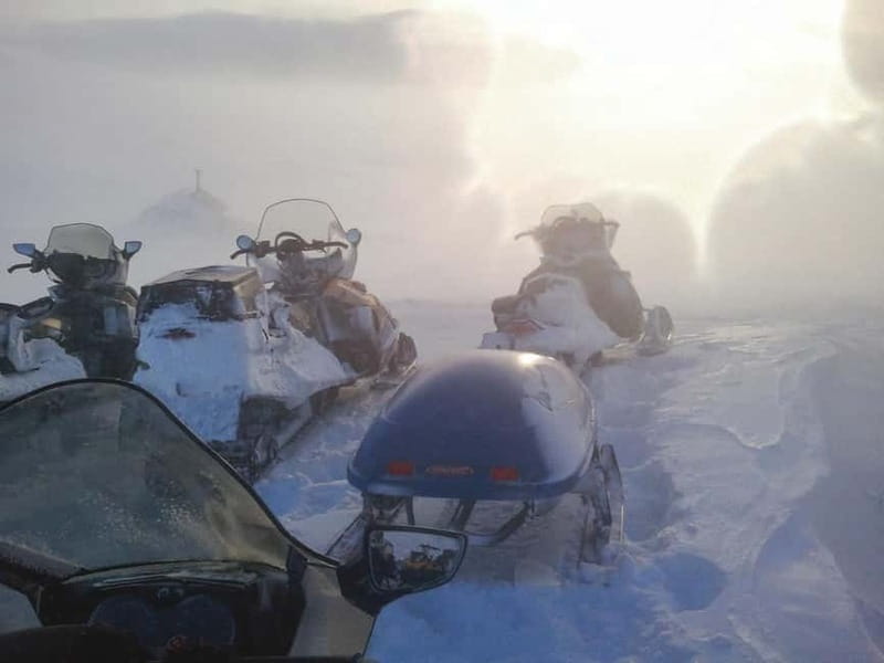 Aurora Hunt on Snowmobile - small groups - Coffee, cookies, and Arctic stories by the fire