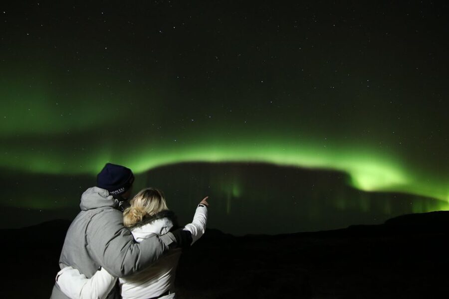 From Reykjavík: Northern Lights Tour with Hot Cocoa & Photos - Chasing a moving target after dark