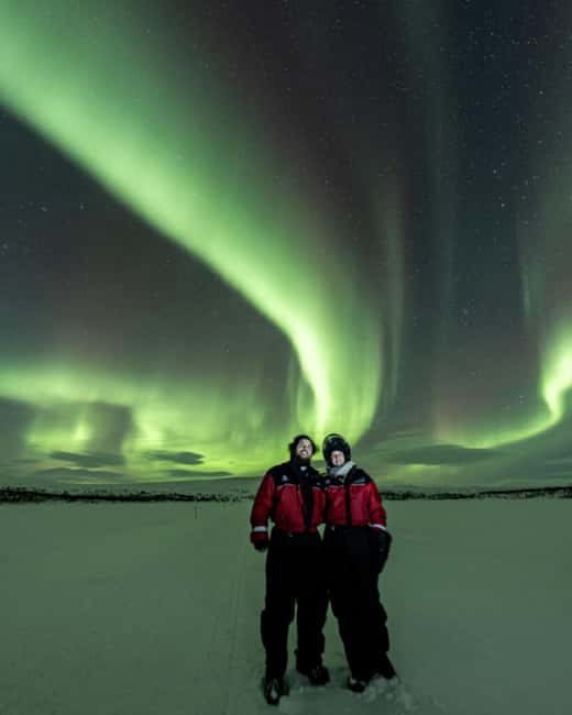 Kilpisjärvi: Northern Lights Snowmobile Tour with Photos - Riding into the dark near Kilpisjärvi
