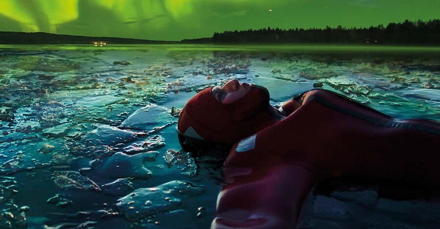 Levi: Ice Floating and Northern Lights Tour - Getting into the Arctic rescue suit