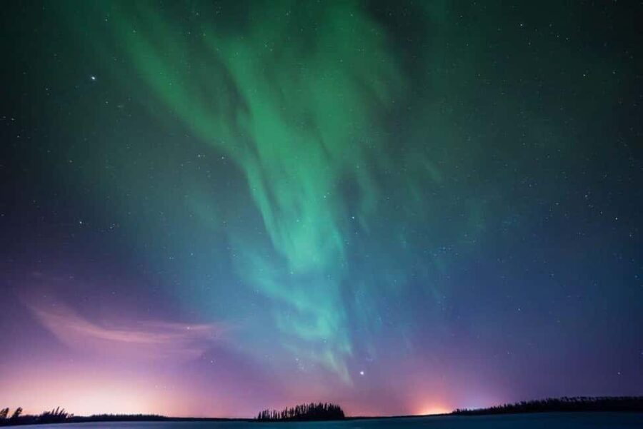 Luleå: Snowmobile Adventures & Northern Lights Hunt - Following the guide through snowy country