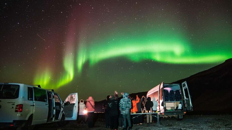 Northern Lights: 4x4 Adventure with Treats, Photos & Cocoa - Waiting outdoors with cocoa and Icelandic pastries