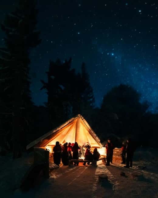Northern Lights Tour Sleigh Ride - The teepee campfire brings the evening together