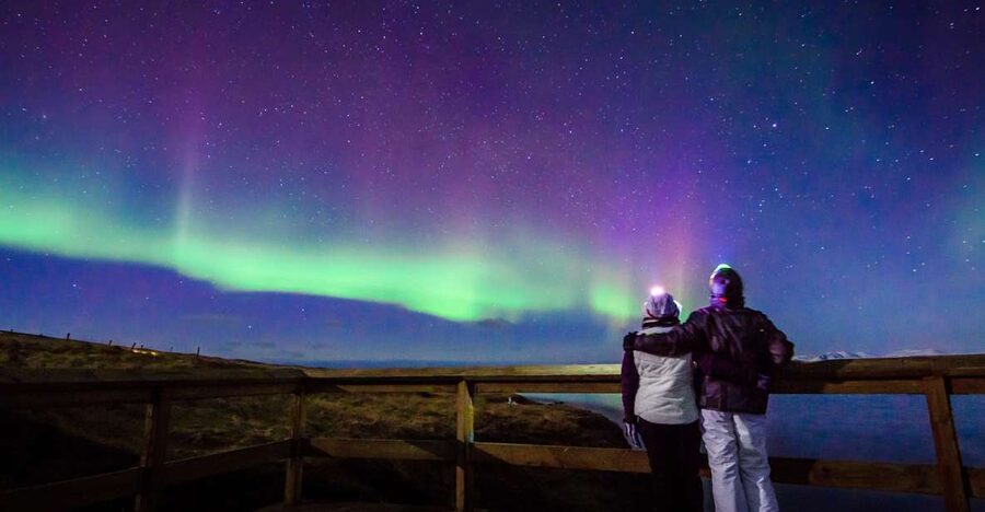 Reykjavík: Northern Lights Minibus Tour with Photos - Leaving Reykjavík after dark