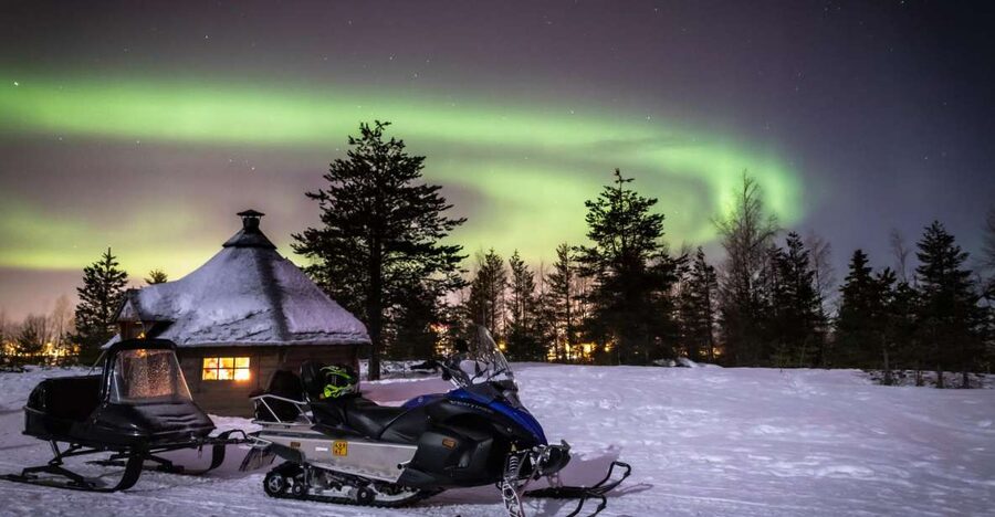 Rovaniemi: Aurora Borealis Snowmobile Safari with Campfire - Riding through forests and across frozen routes