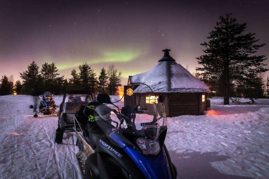 Rovaniemi: Aurora Borealis Snowmobile Safari with Campfire - Warming up with juice, cookies, and fire